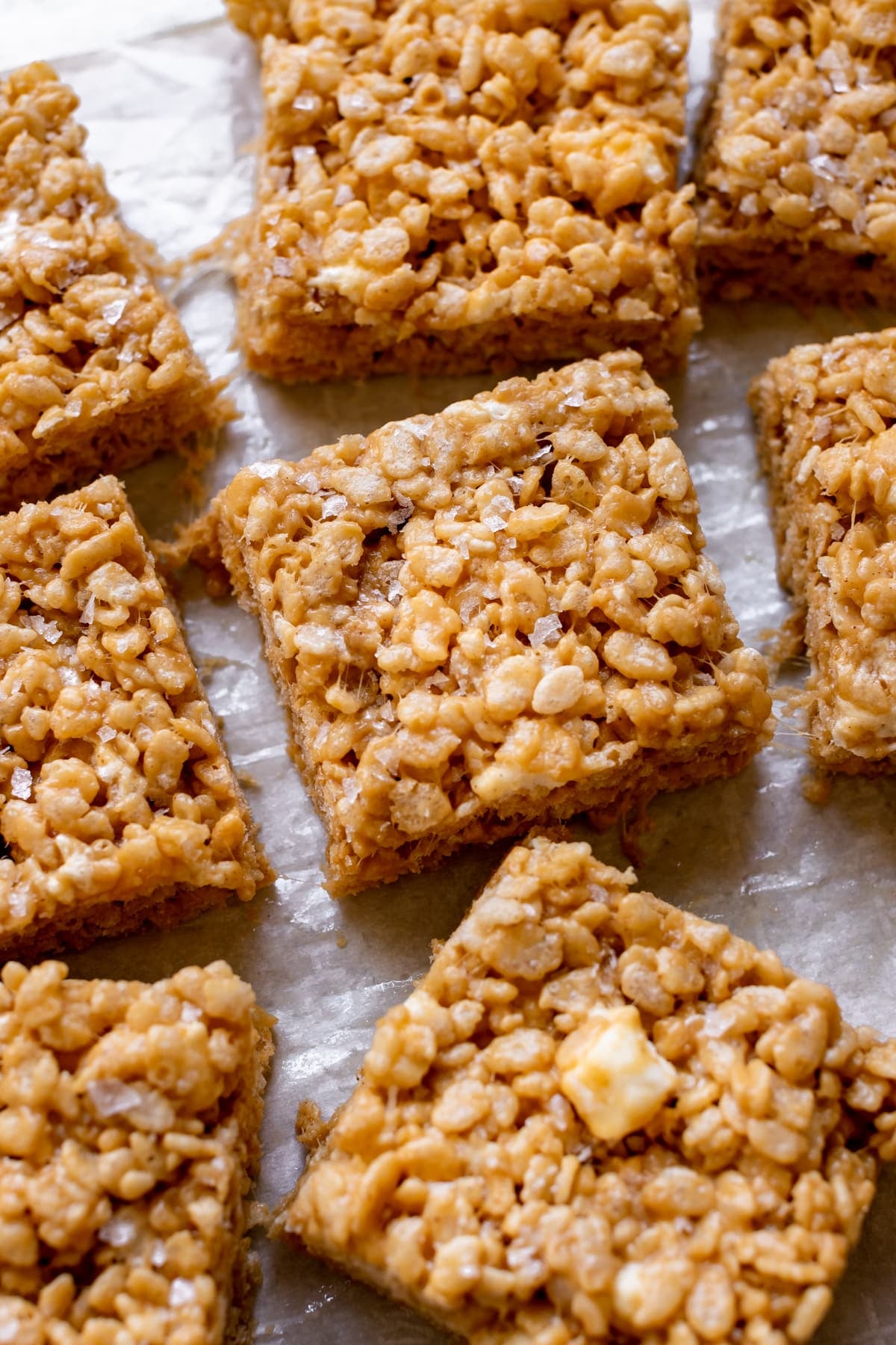 rice crispy treats garnished with flaky sea salt cut into squares