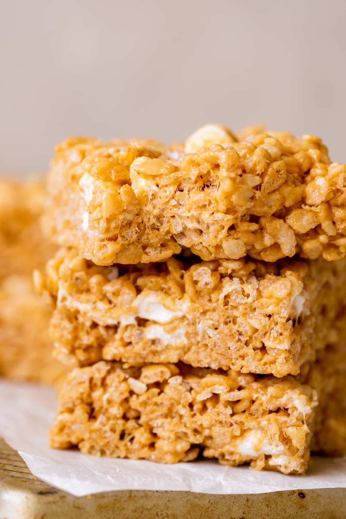 a stack of rice krispy treats on parchment paper