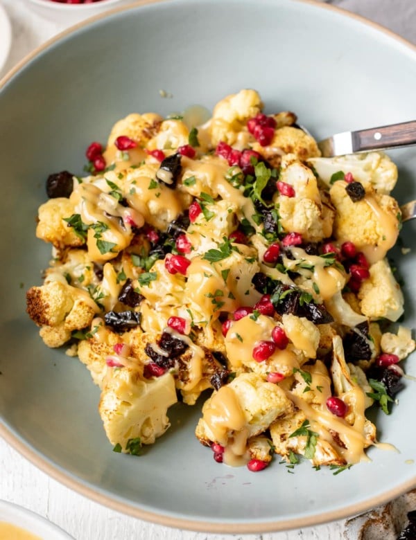 cauliflower drizzled in a mustard sauce with pomegranate perils & green spices
