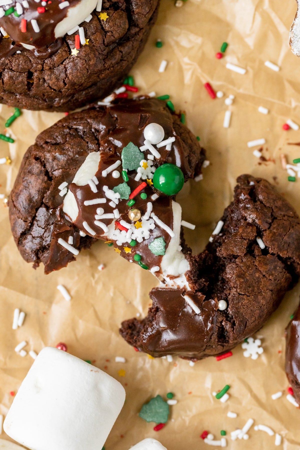 a brownie like cookie with a marshmallow in the center and sprinkles on top.