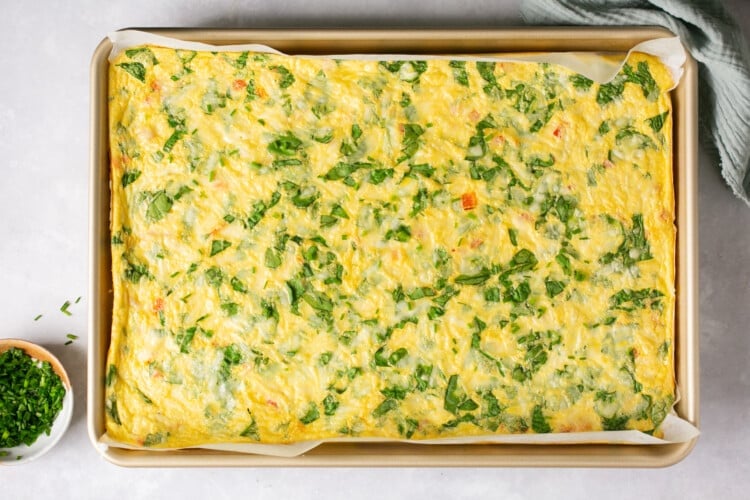 cooked eggs & veggies on a sheet pan