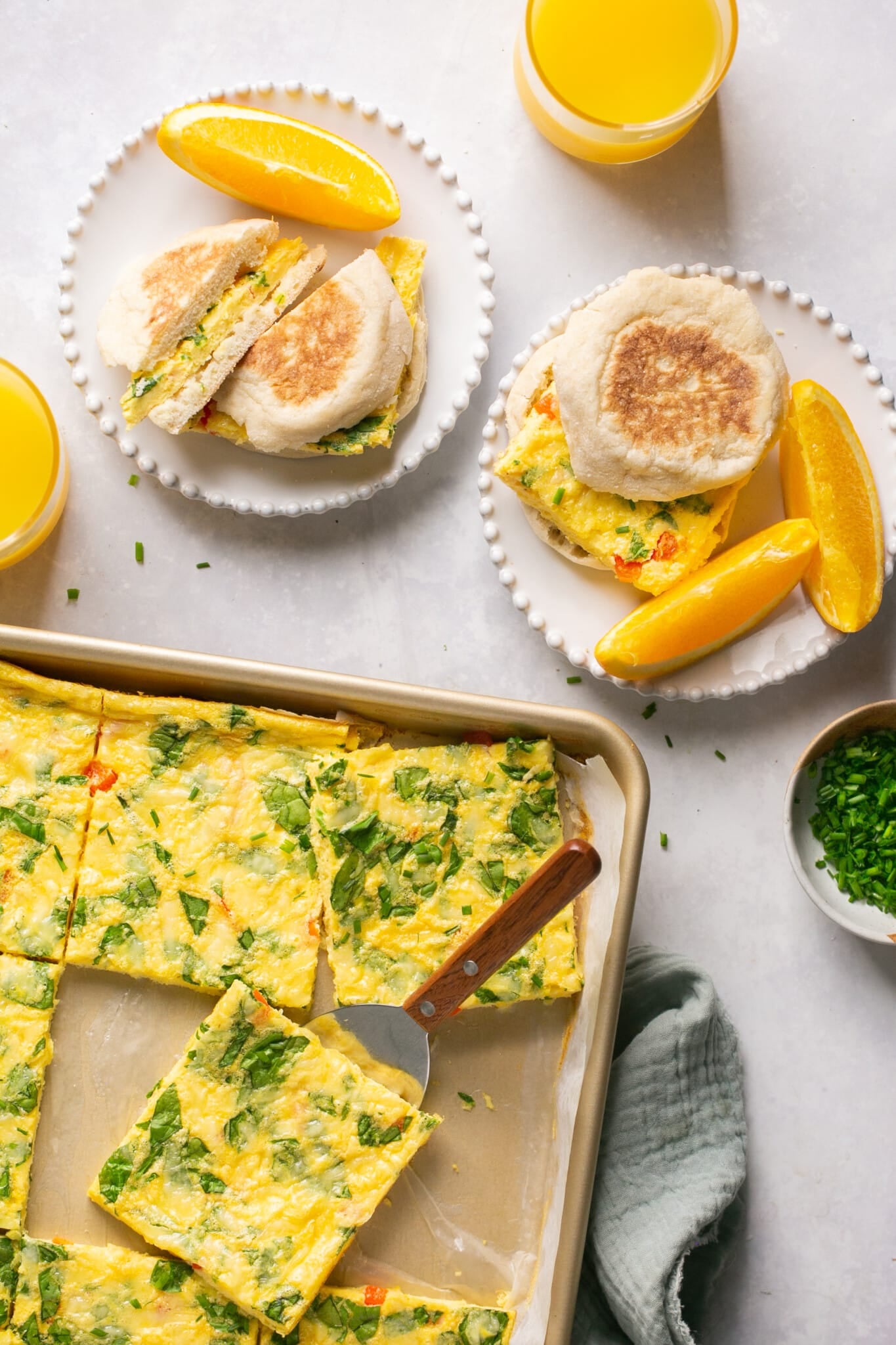 eggs on a sheet pan and on an English muffin. 