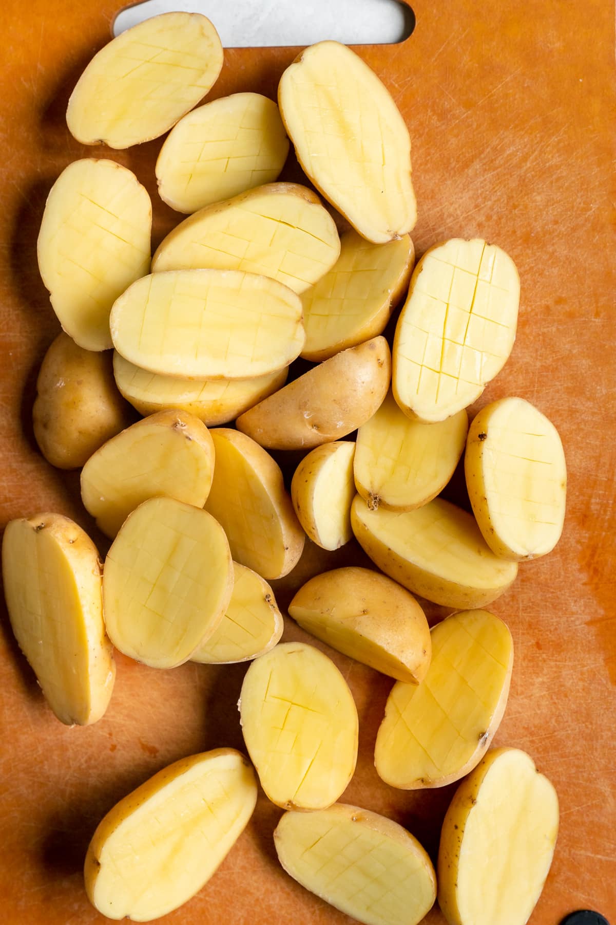 yukon gold potatoes on a cutting board. 