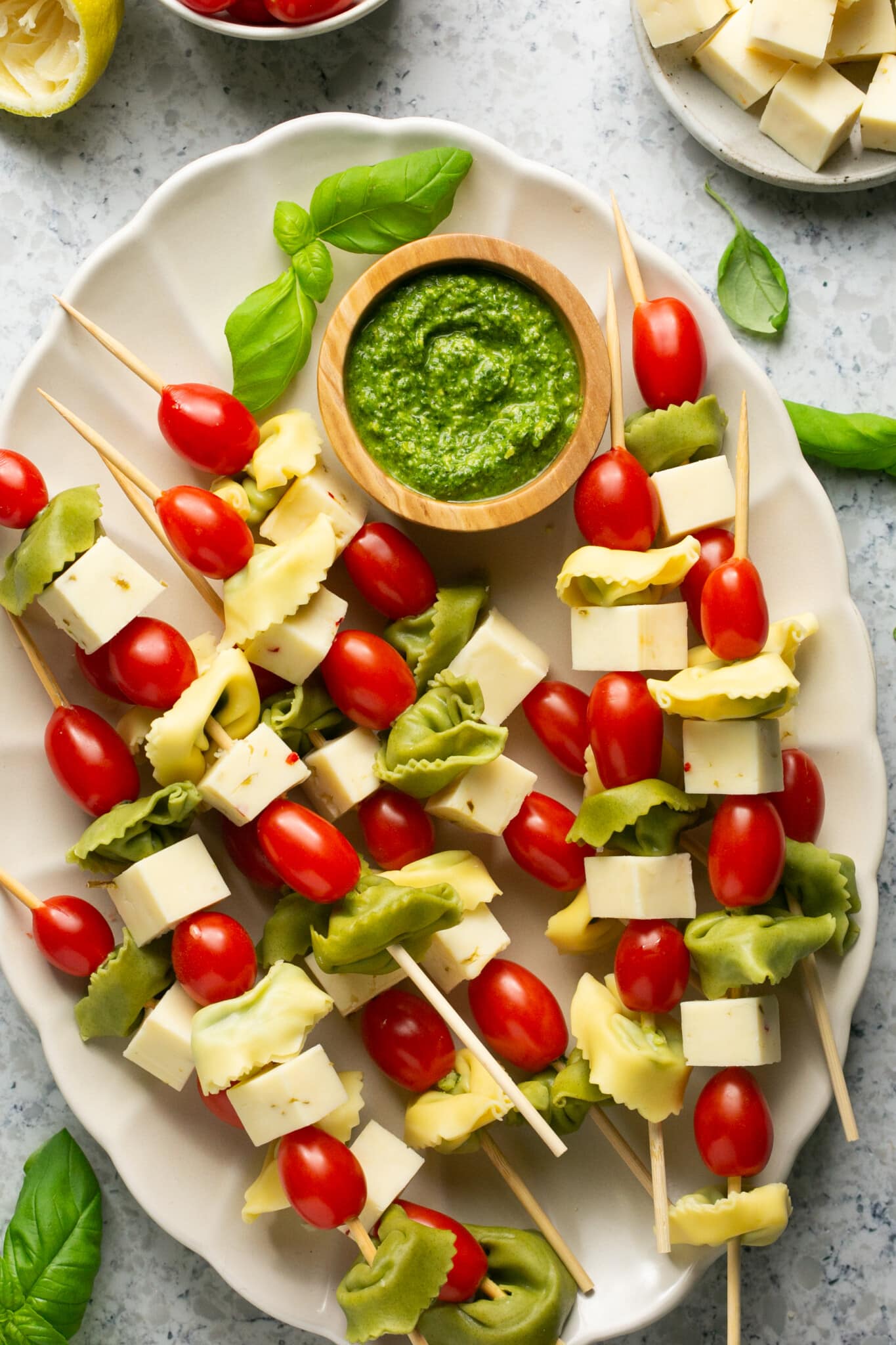 tortellini on skewers with cheese and cherry tomatoes. 