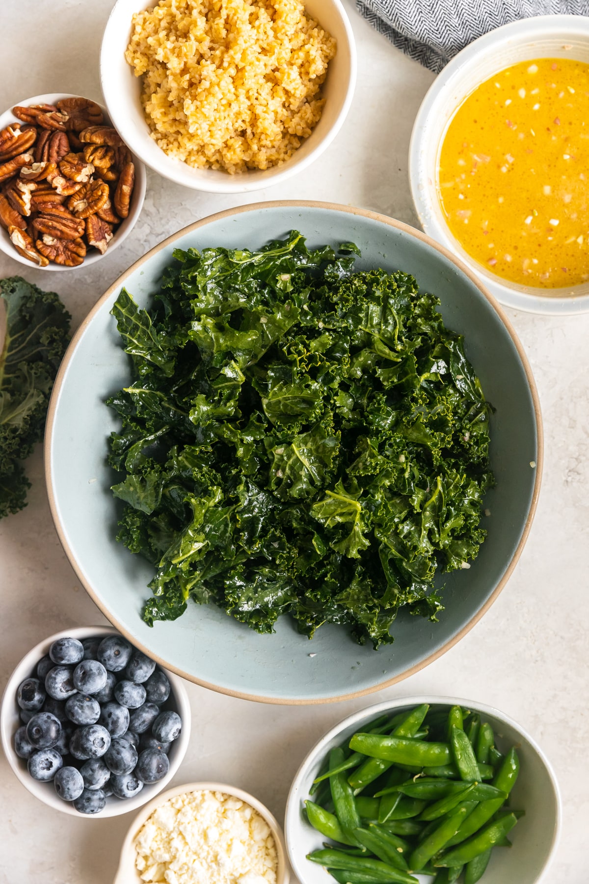 kale in a large blue bowl.