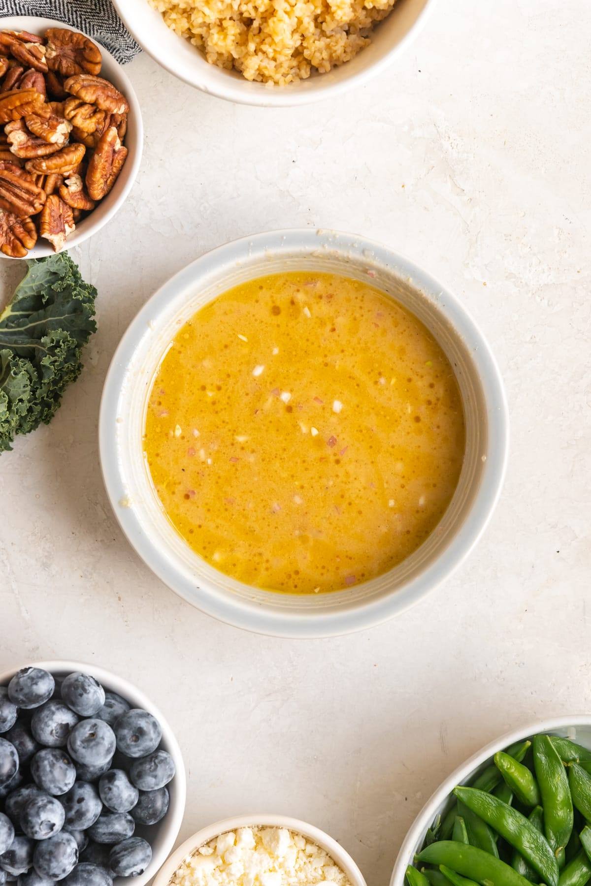 salad dressing in light blue bowl.