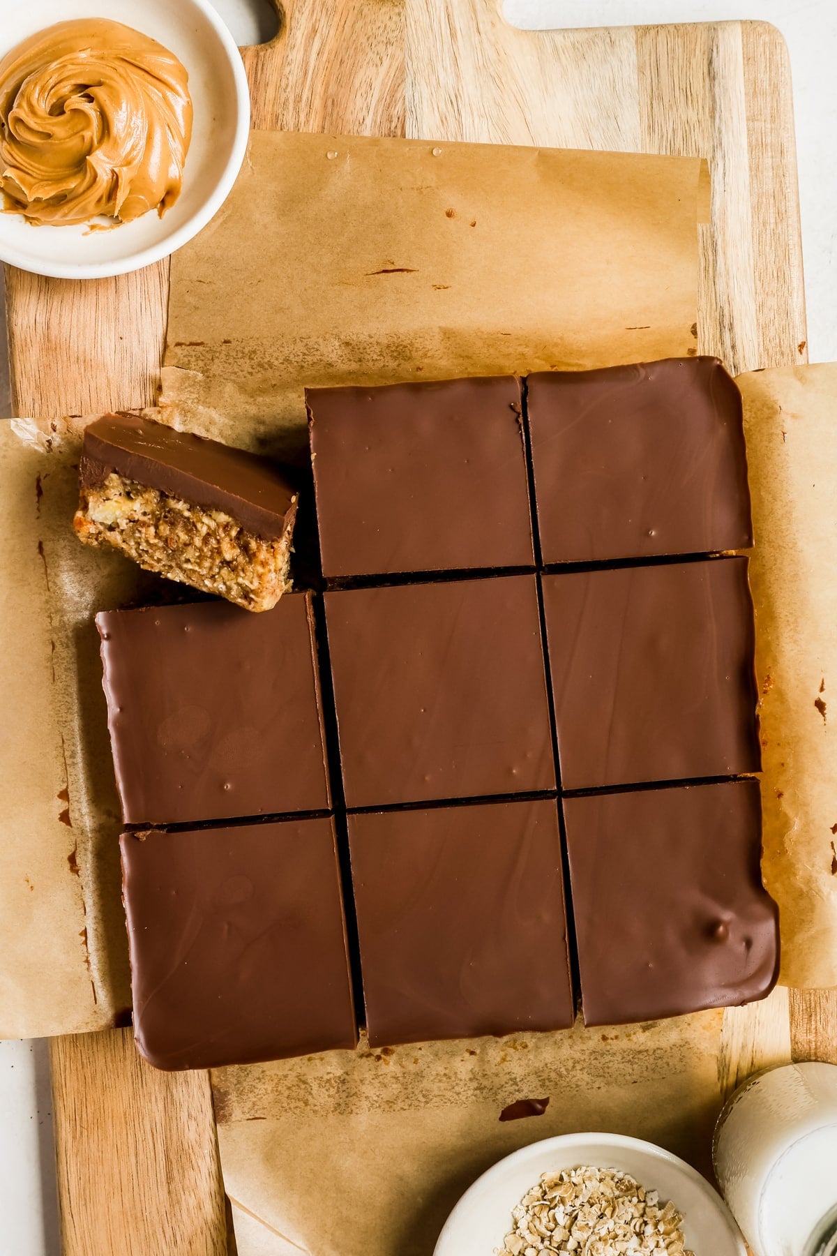breakfast bars cut into 9 bars on a cutting board. 