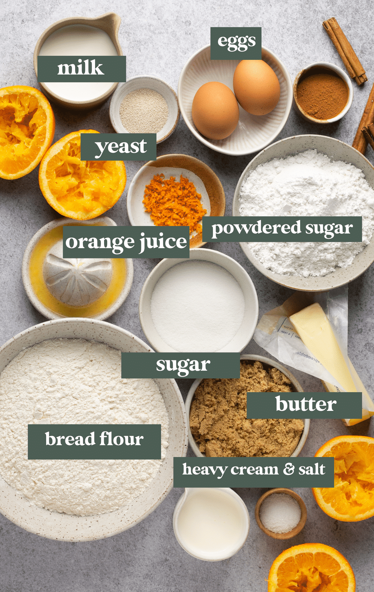 ingredients in small bowls needed to make cinnamon rolls with oranges.