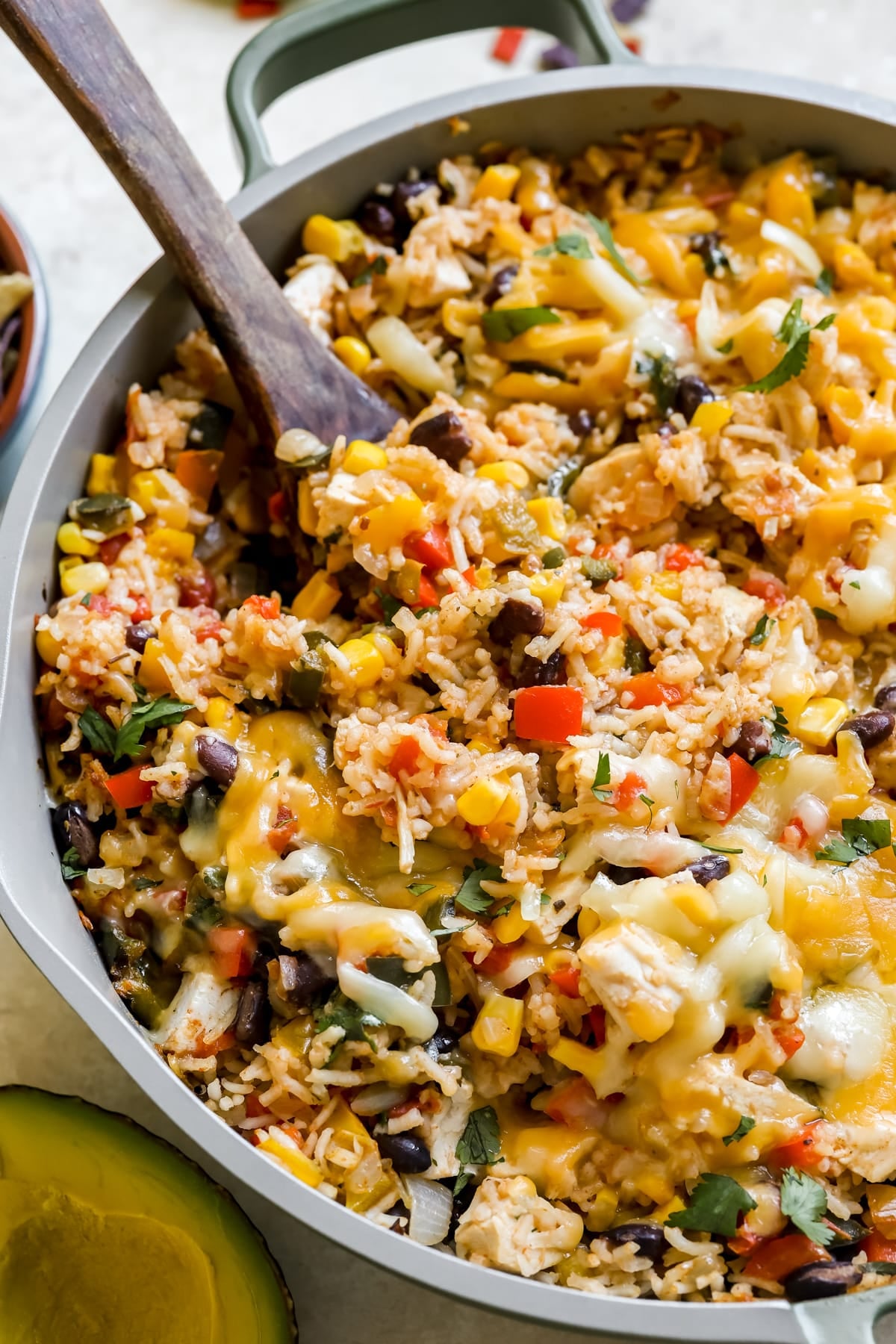 chicken, rice and cheese in a skillet.