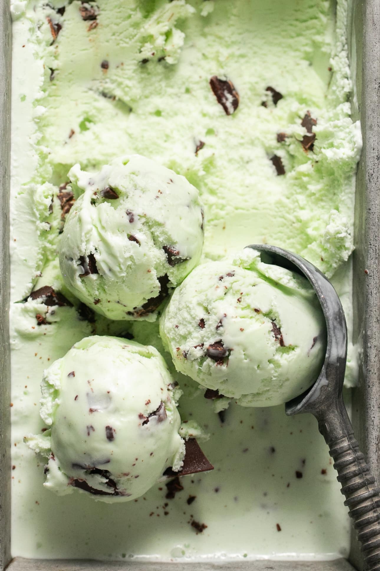 an ice cream scoop scooping ice cream. 
