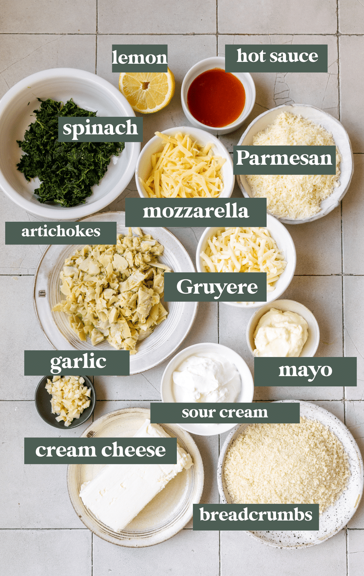 ingredients in small white bowls needed to make a dip. 