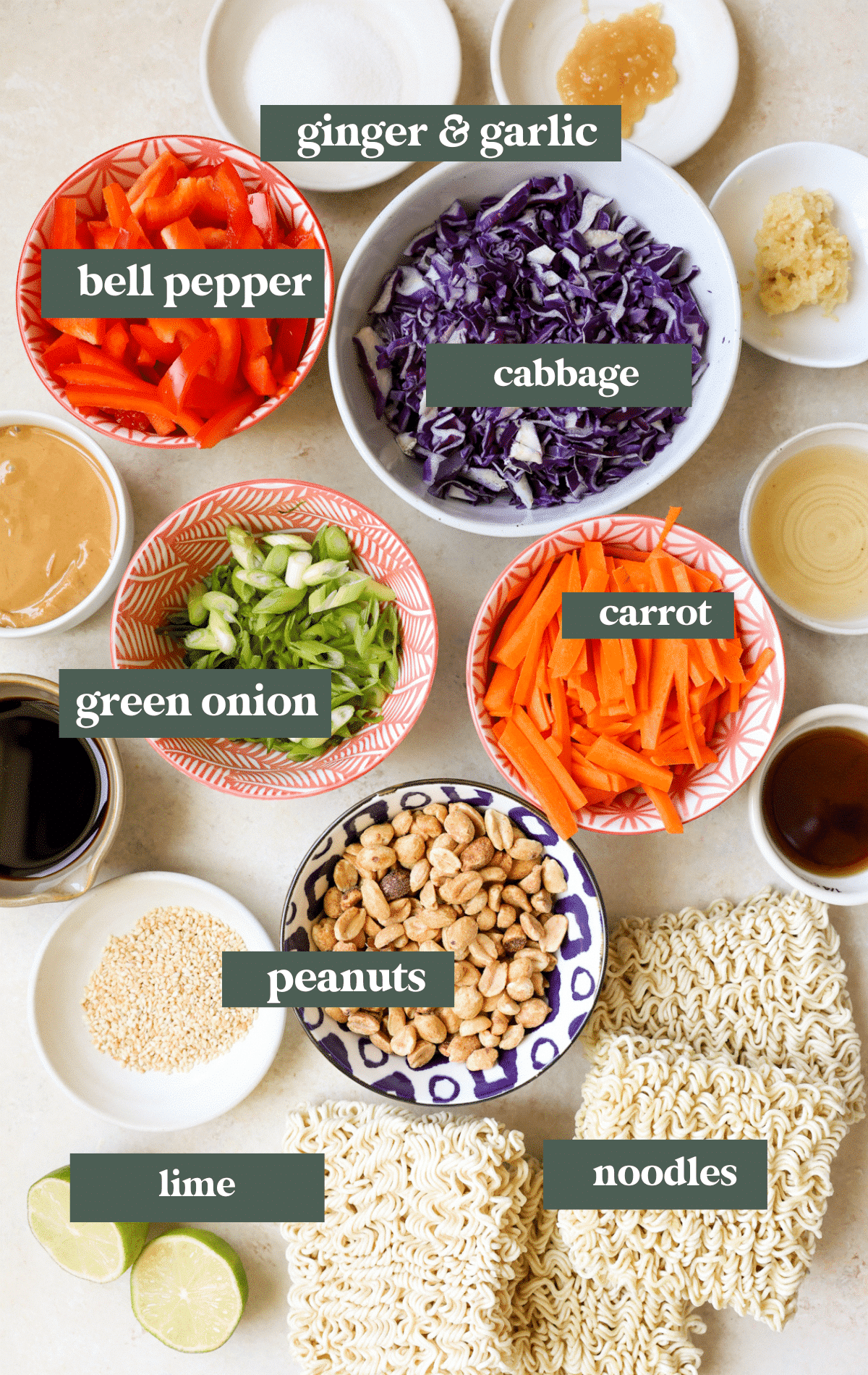 ingredients in small white bowls needed to make a noodle salad.
