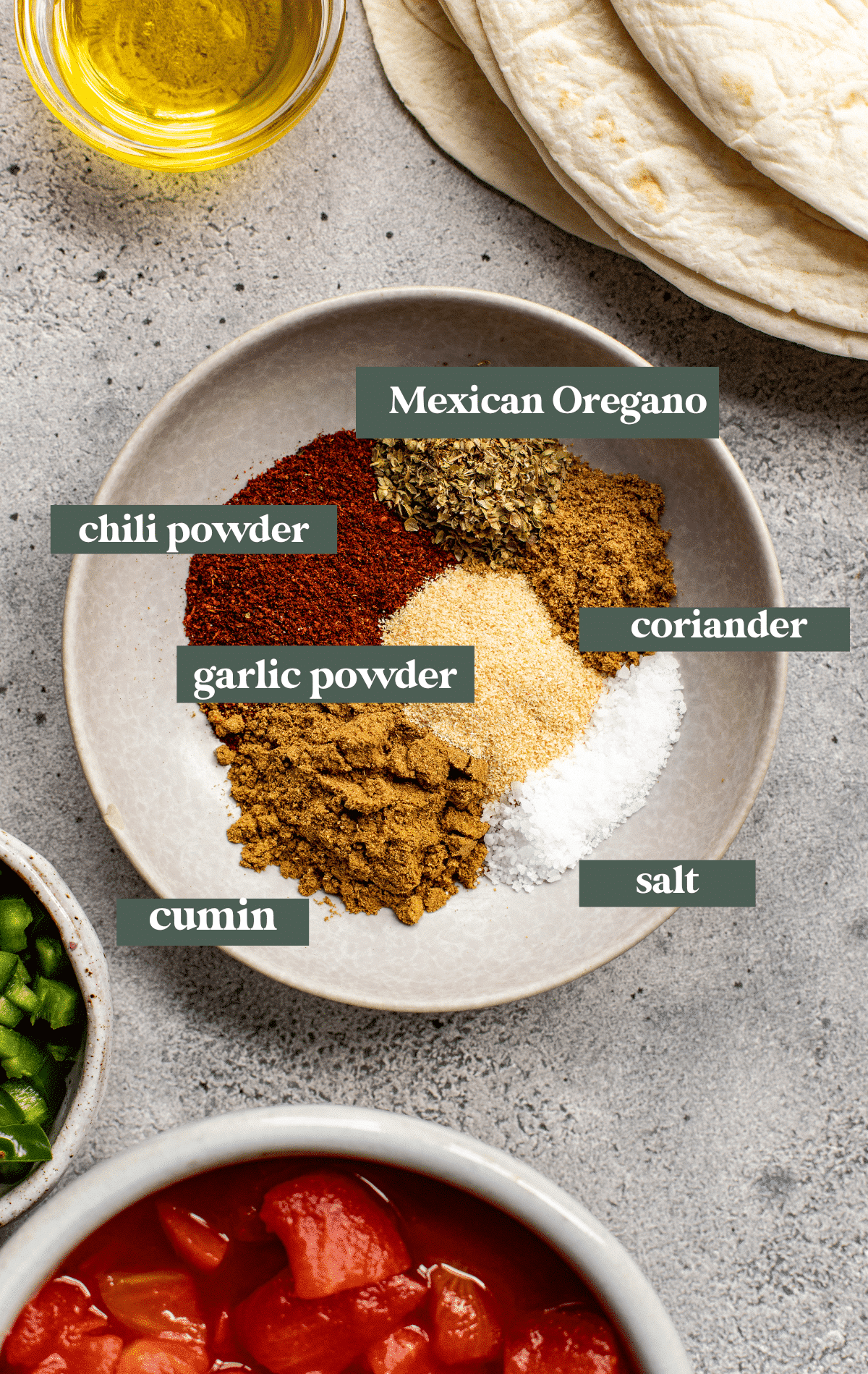 seasonings in a grey dish for enchiladas. 