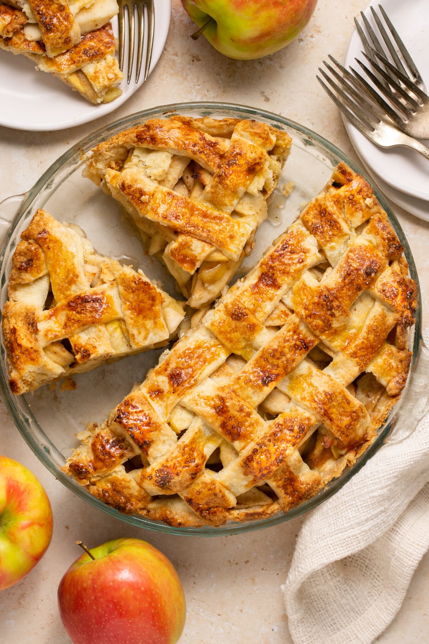 a baked pie in a glass pie plate.