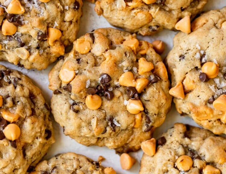 tray with multiple cookies with butterscotch and chocolate chips topped with flaky sea salt