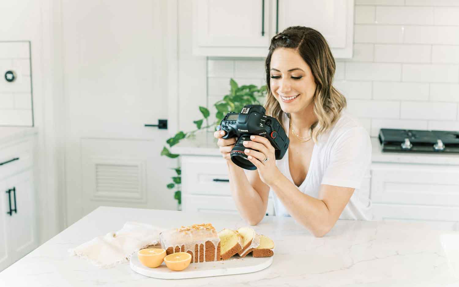 Tawnie photographing food in her kitchen.