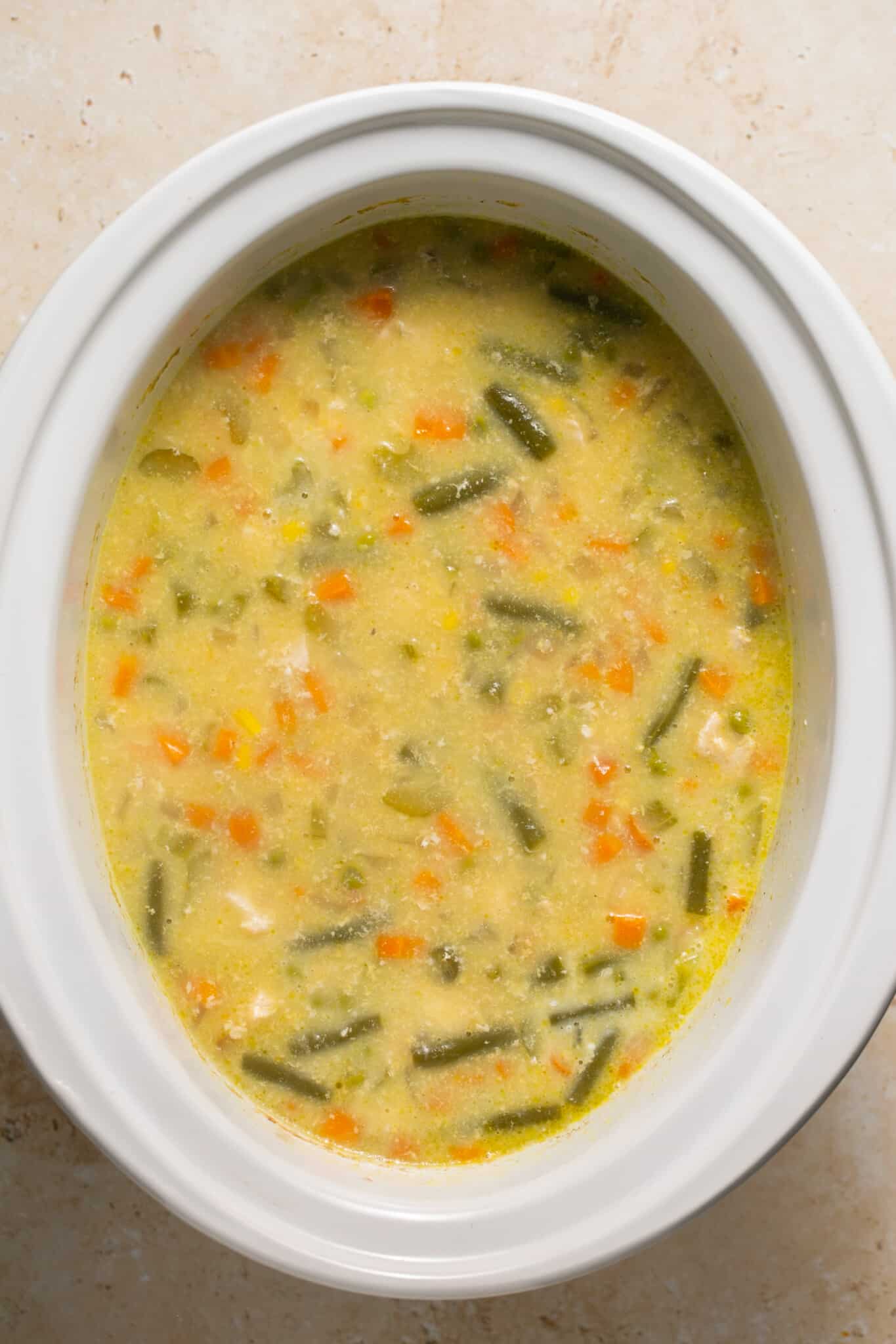 soup in a white crock pot.