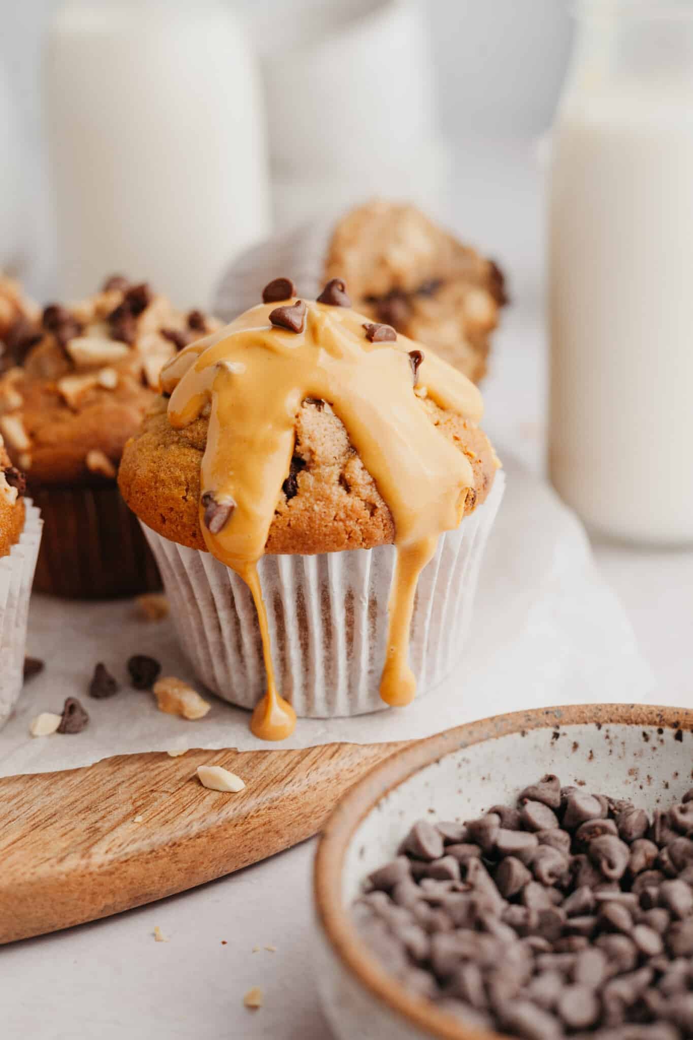 peanut butter drizzled on top of a muffin. 