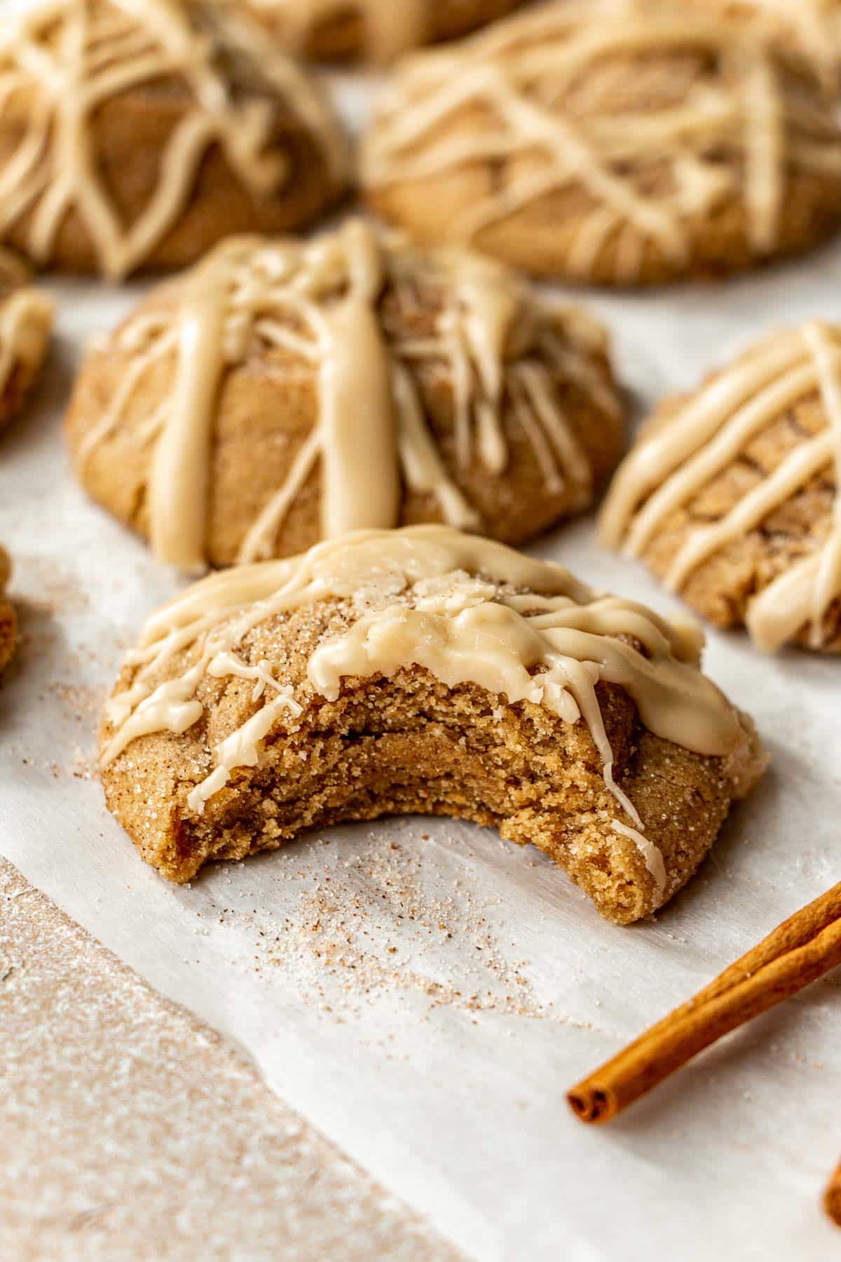 a bite taken out of a maple cookie. 