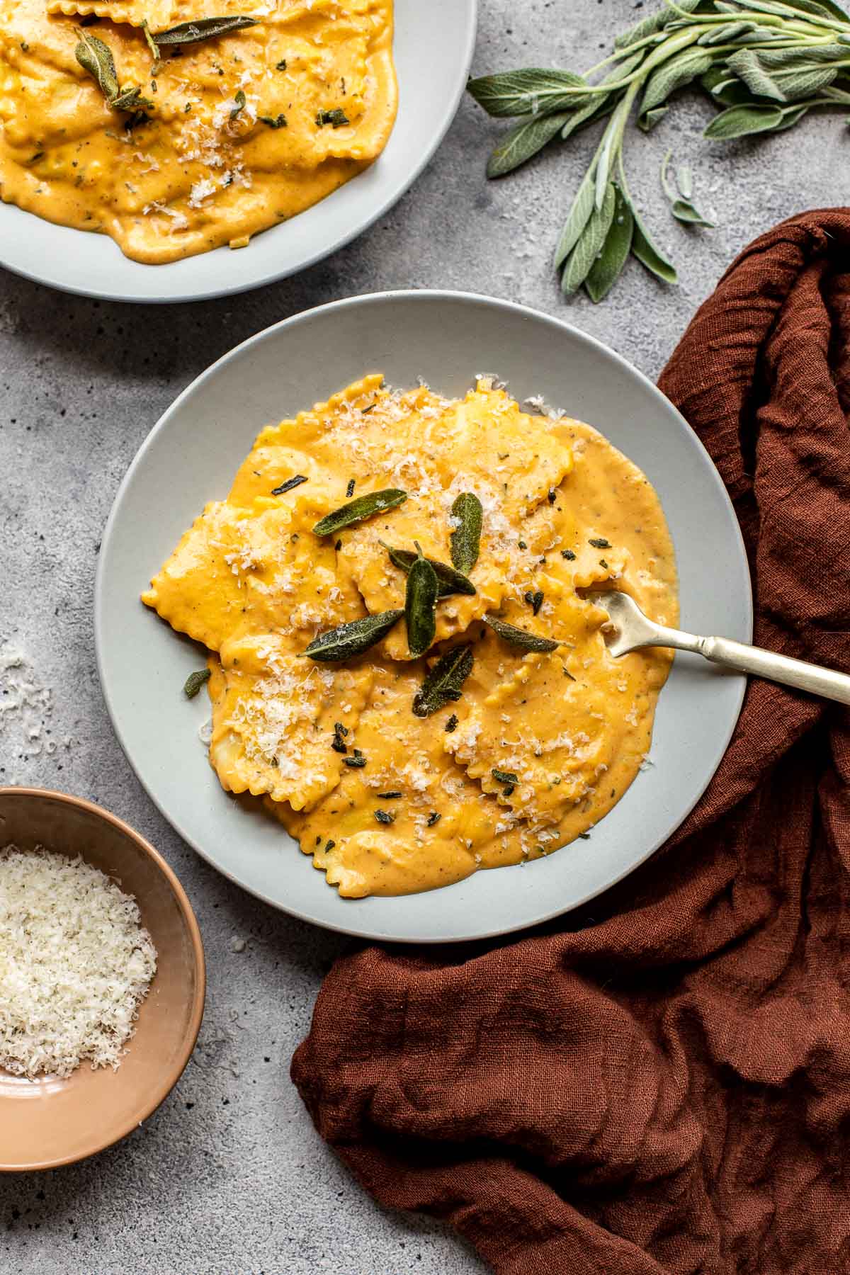 pumpkin alfredo with fresh sage and parmesan cheese on top.