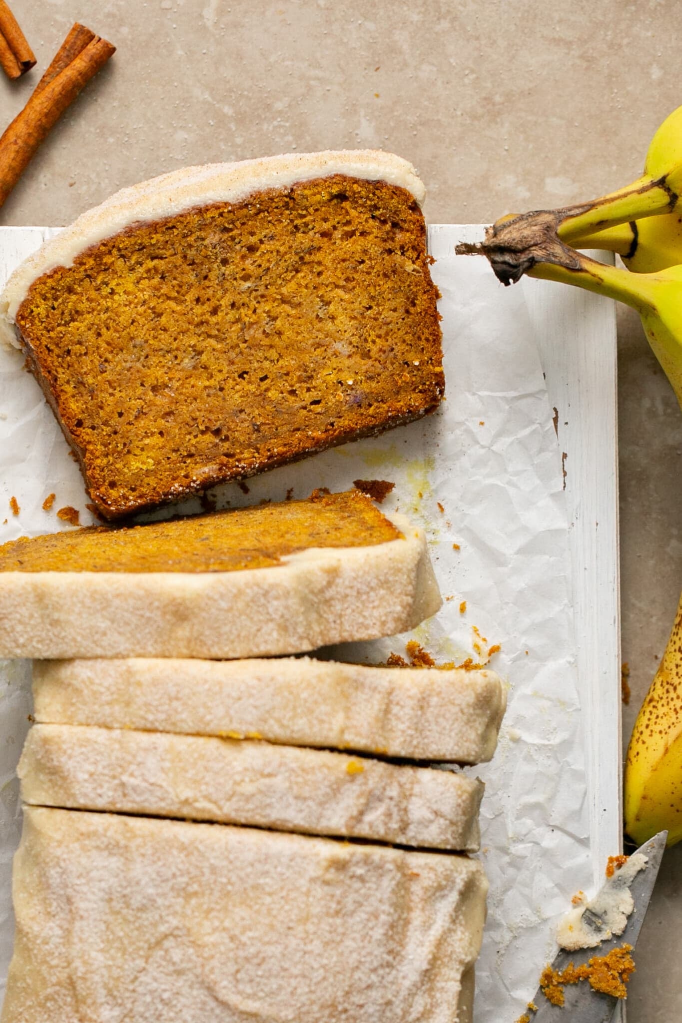 sliced banana bread topped with a maple glaze. 