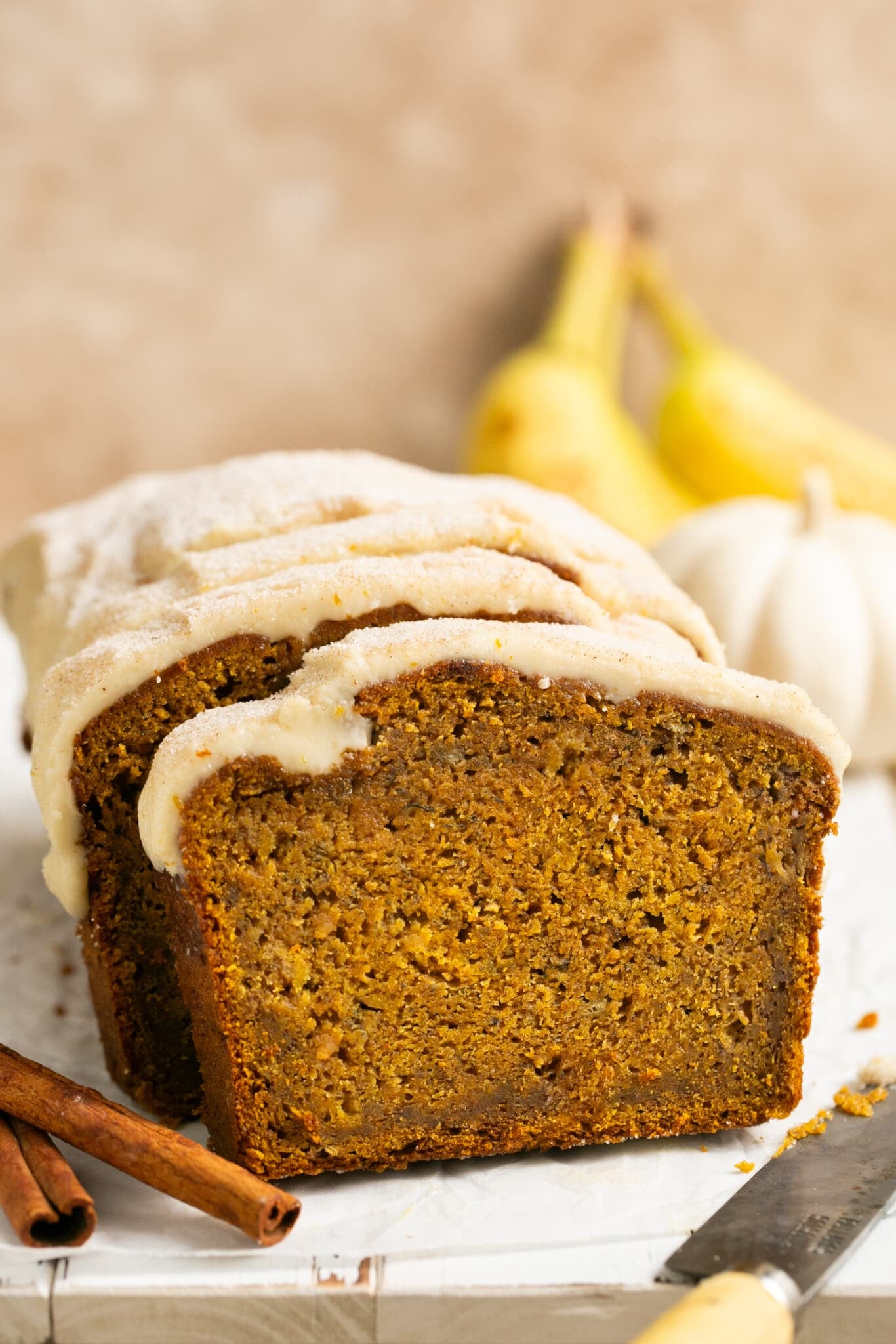 sliced banana bread topped with a maple glaze. 