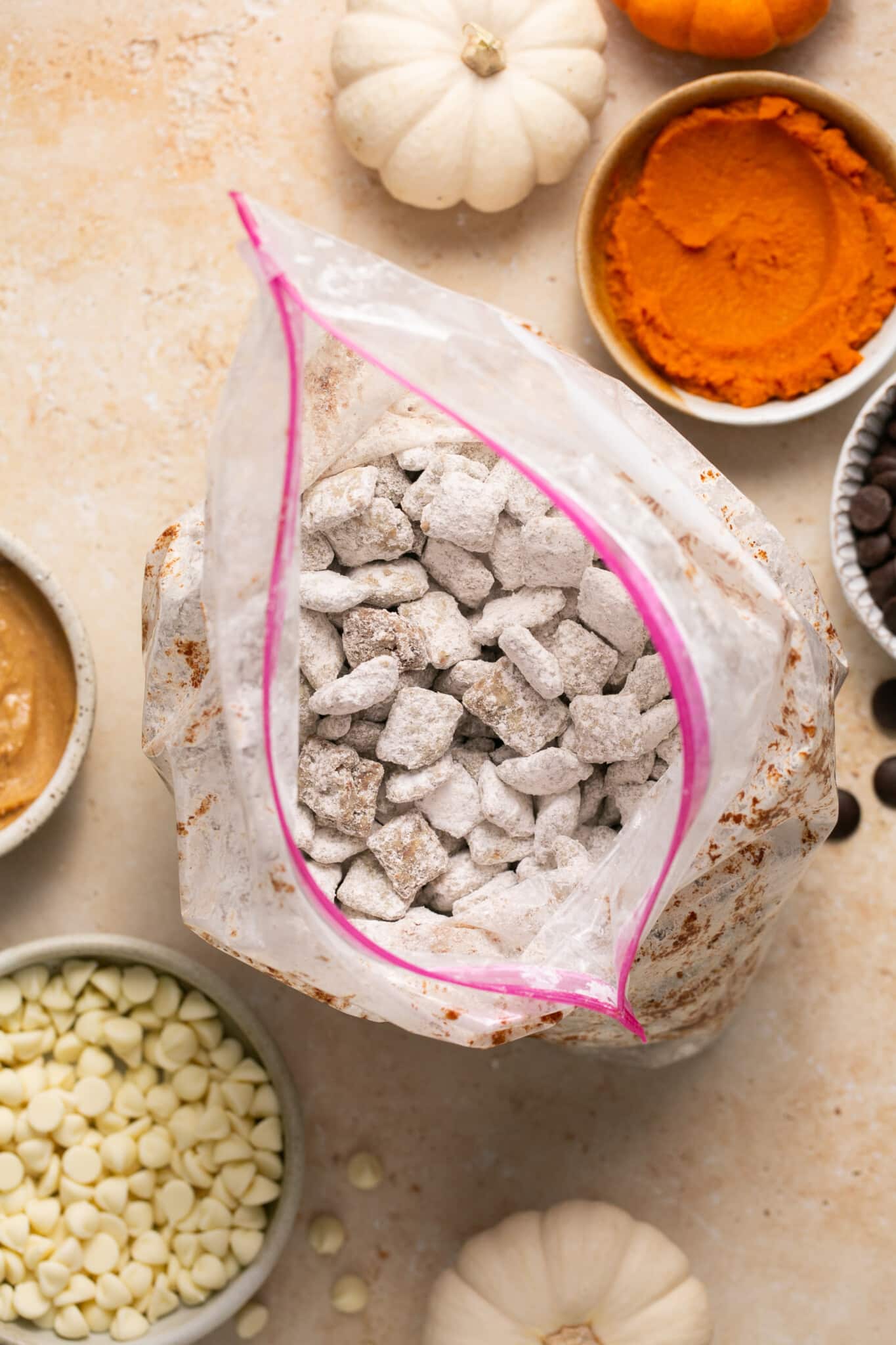 puppy chow covered in powdered sugar in a plastic ziptop baggie. 