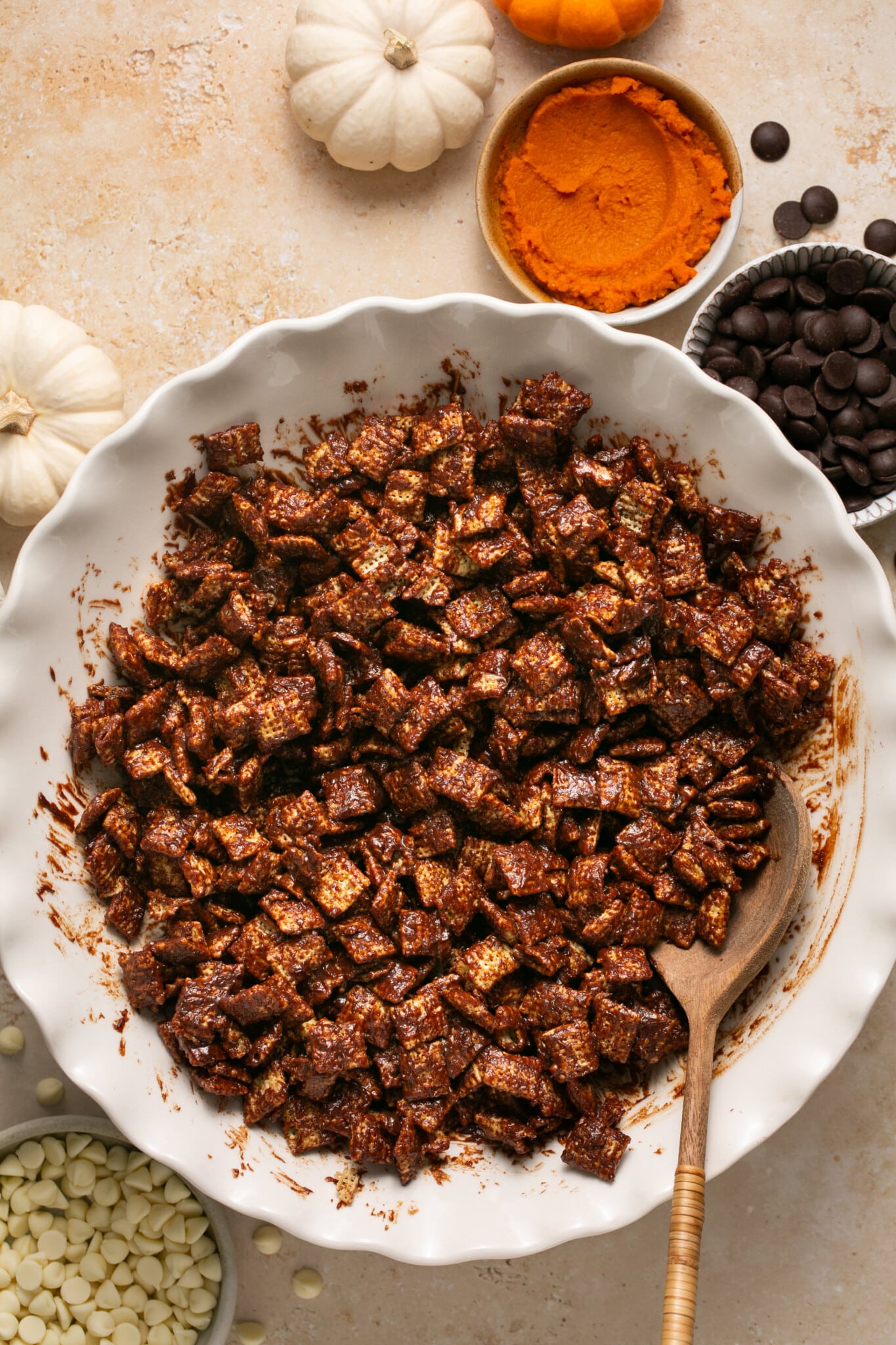 rice chex in a white bowl with chocolate mixed in. 