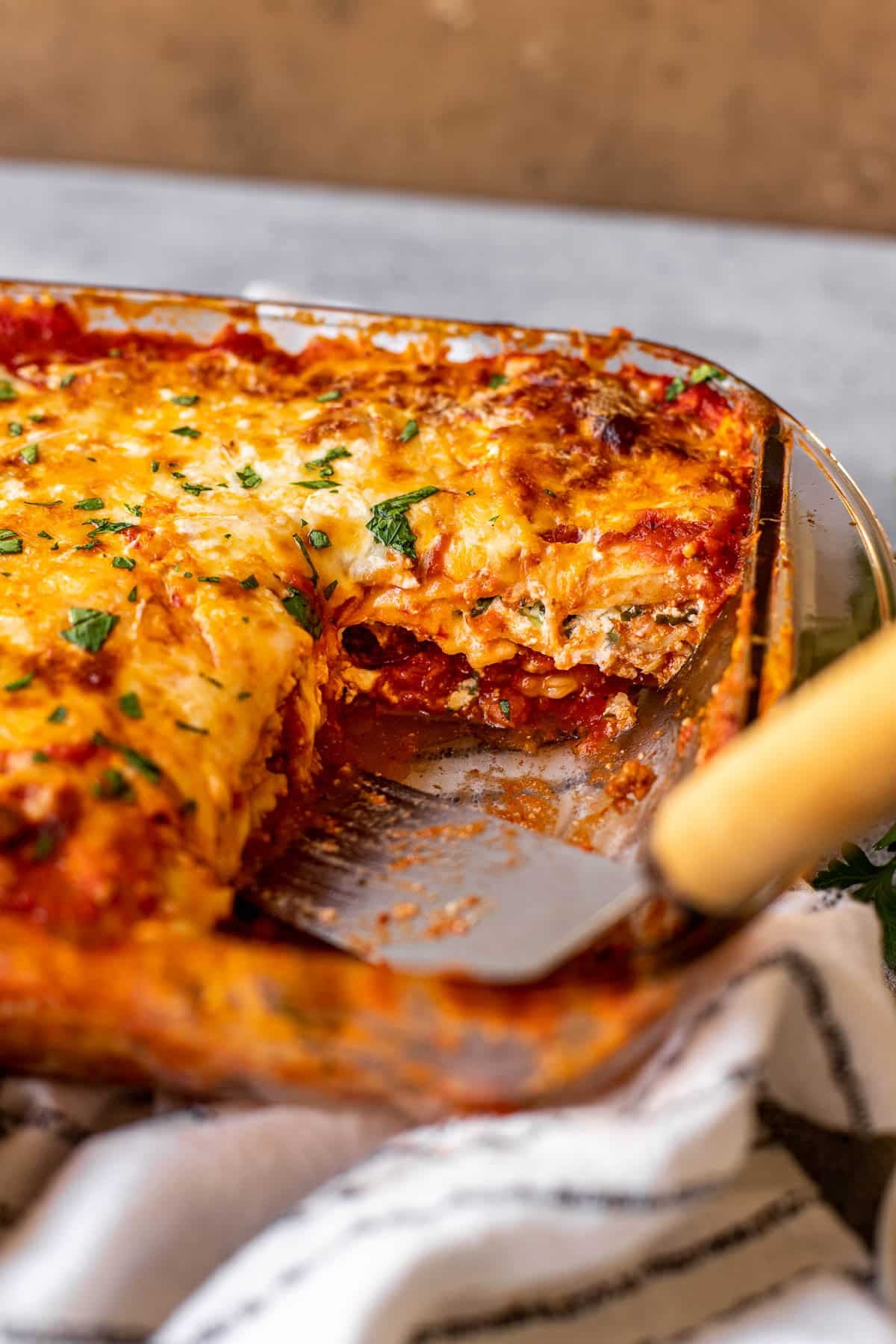Ravioli lasagna in a glass baking dish. 