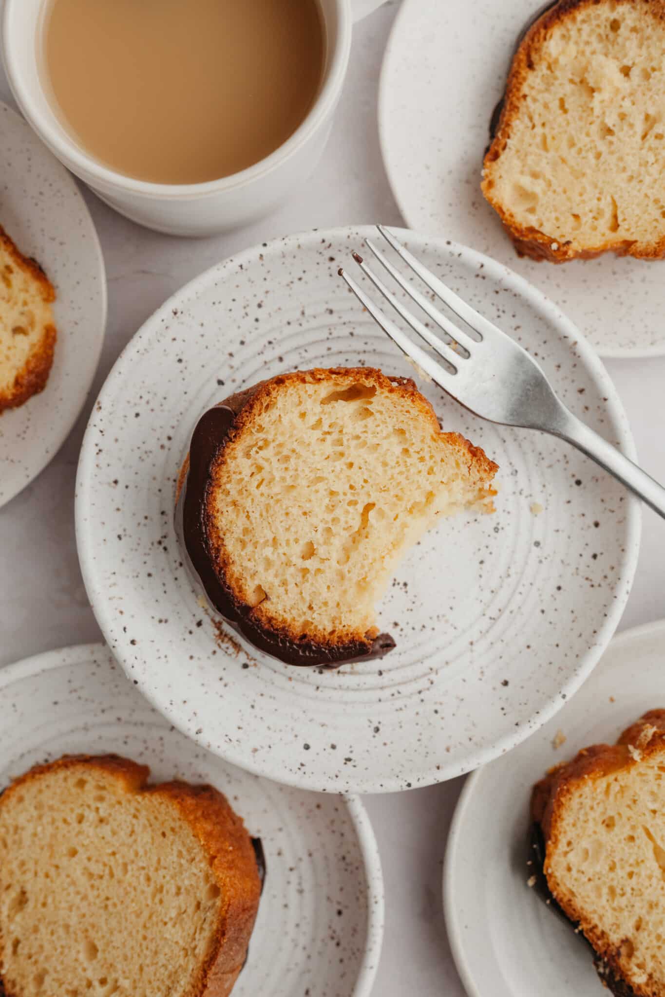 rum cake on a white speckled plate. 