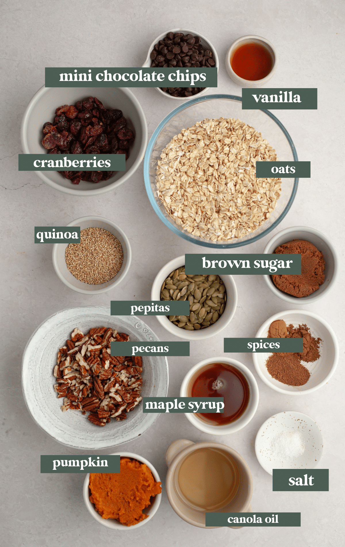 ingredients in small glass bowls needed to make homemade granola.
