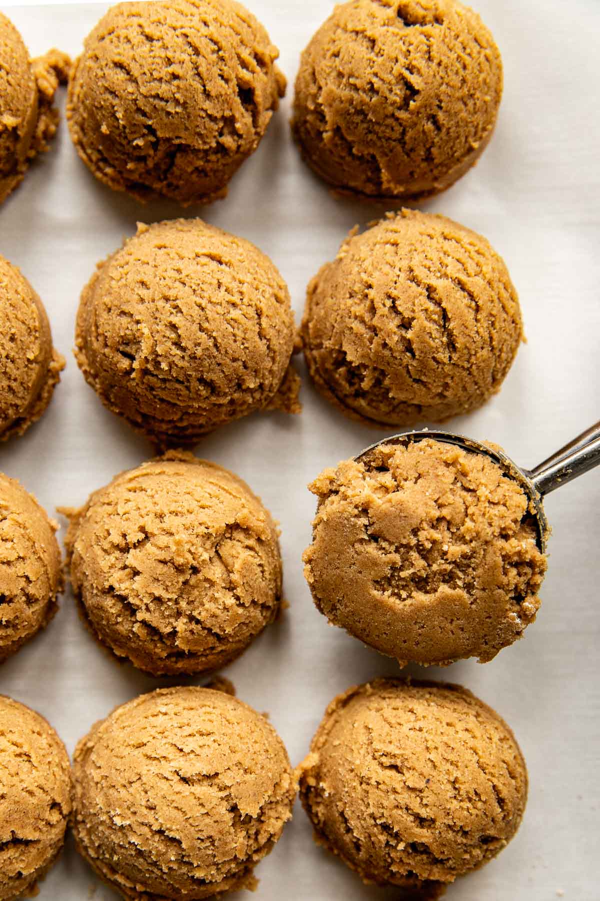 an up close image of scooped cookie dough. 