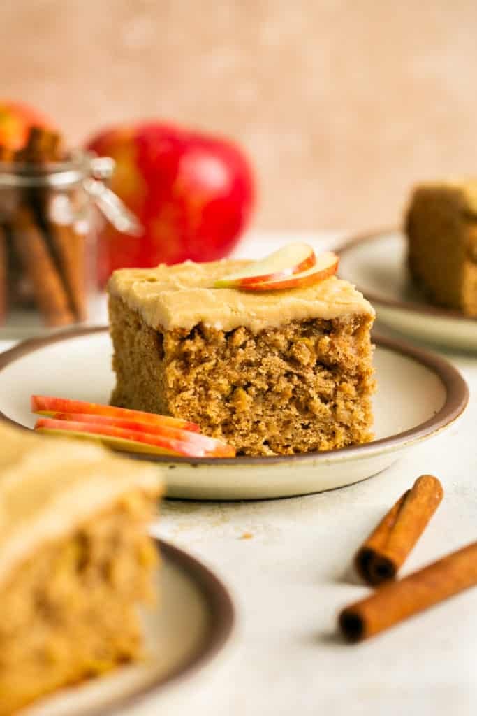 a slice of cake with apples on top. 