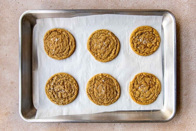 six cookies on a baking sheet