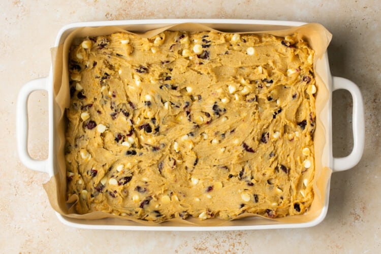 cranberry bliss bar bottom layer dough pressed into a baking tray