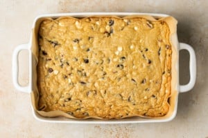 baked cranberry bliss bar bottom layer in a baking tray