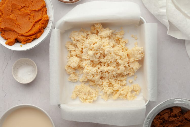 crumbled pie crust prior to pressing into square baking pan