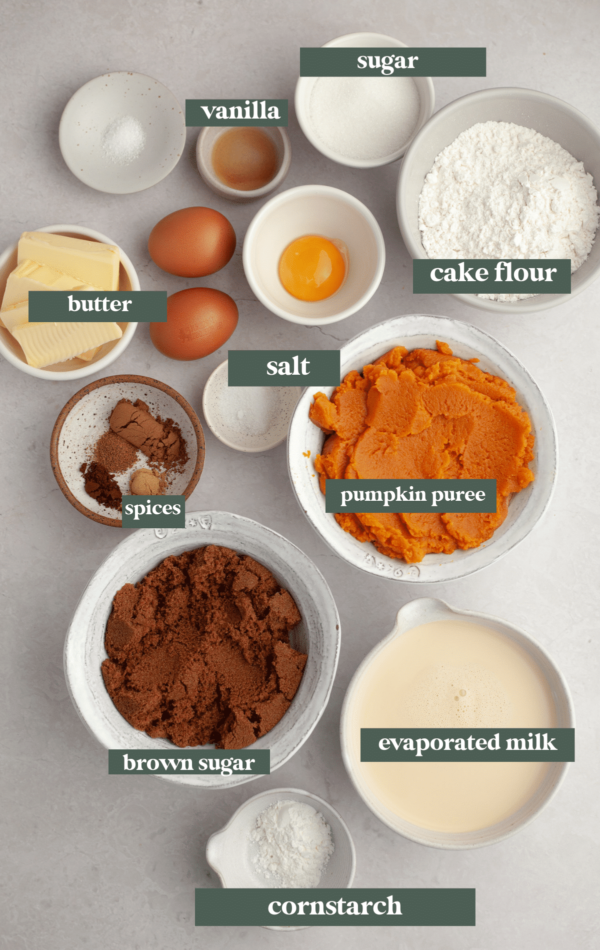 ingredients to make pumpkin pie bars in glass bowls.
