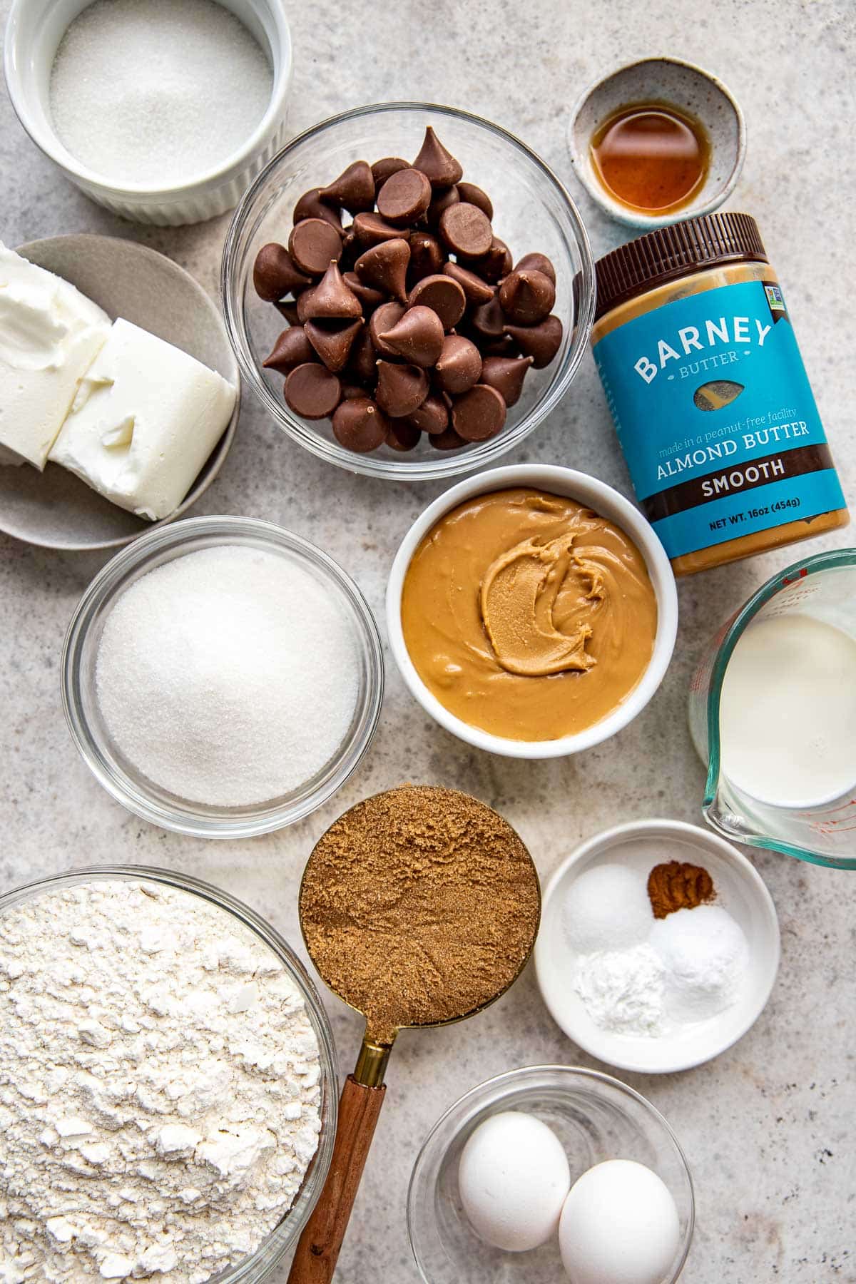 ingredients needed to make almond. butter blossoms in glass bowls. 