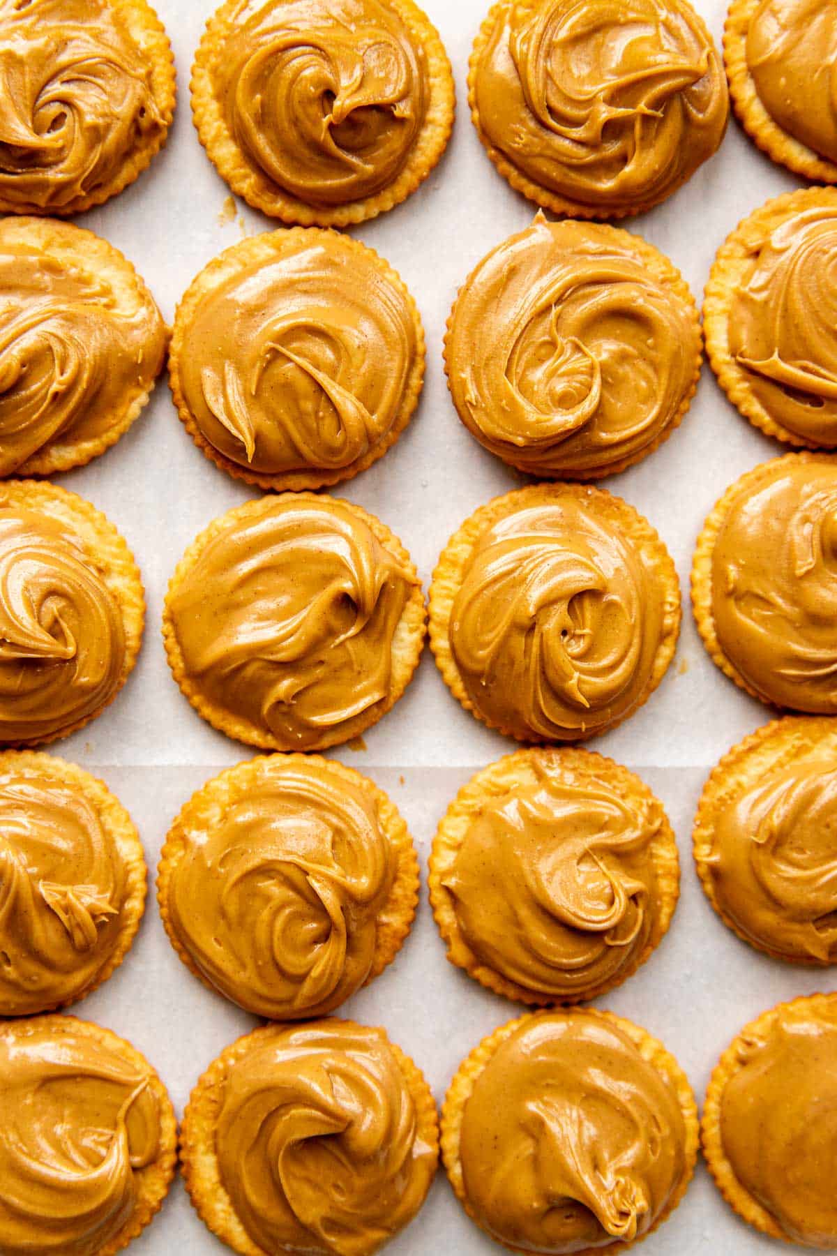 peanut butter spread on top of ritz cookies. 