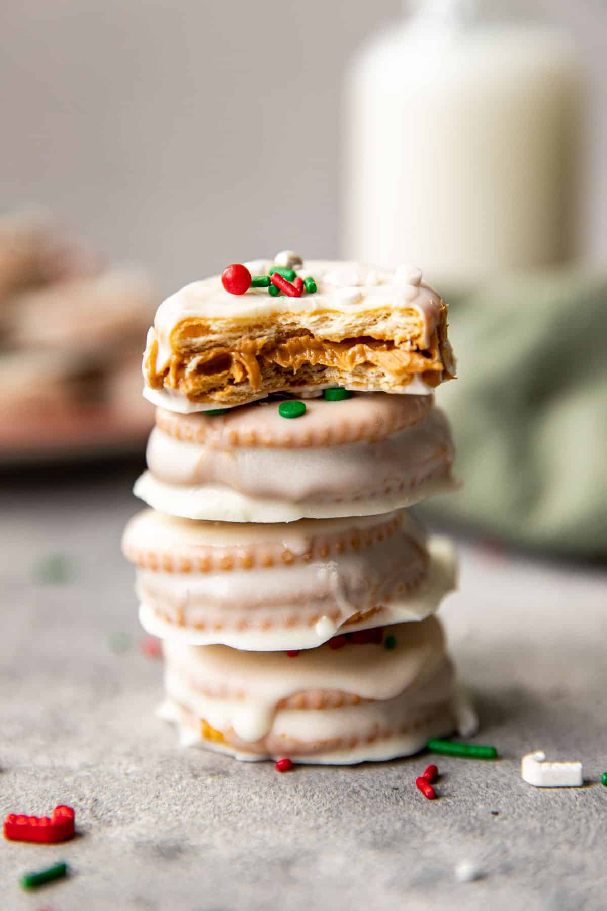 a stack of ritz crackers coated in white chocolate. 