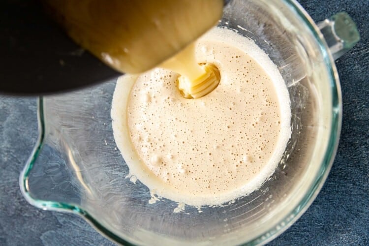 melted butter being poured into cookie batter
