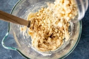 wooden spoon stirring cookie dough