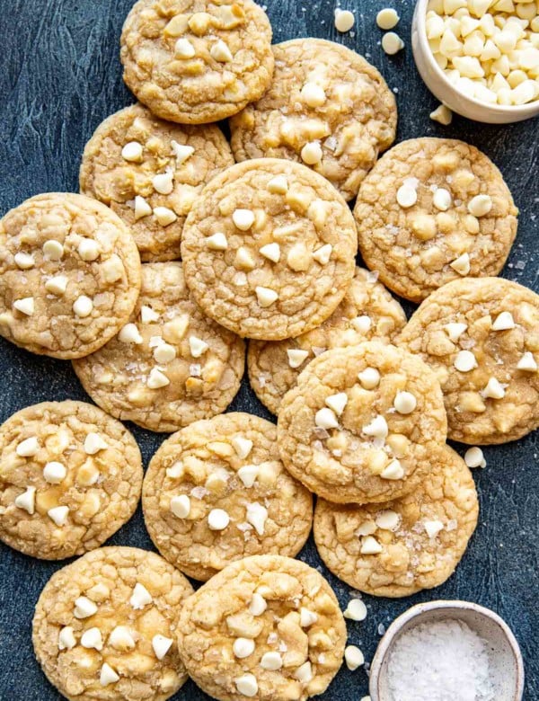 cookies with macadamia nuts and white chocolate chips laying on top of one another