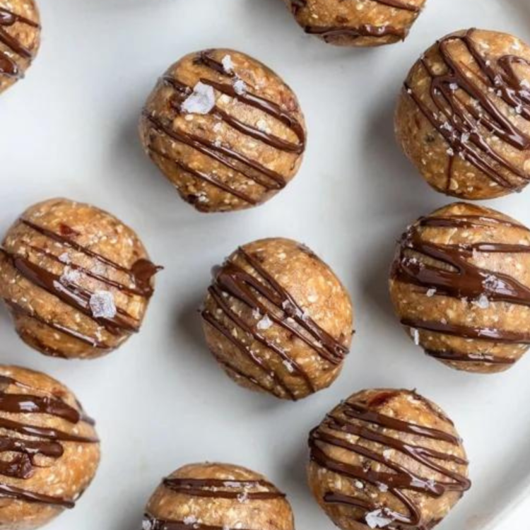 plate with energy balls drizzled with chocolate
