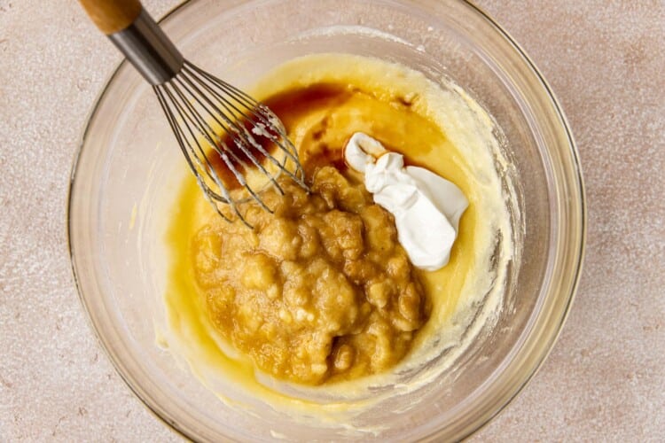 clear bowl with ingredients being whisked together