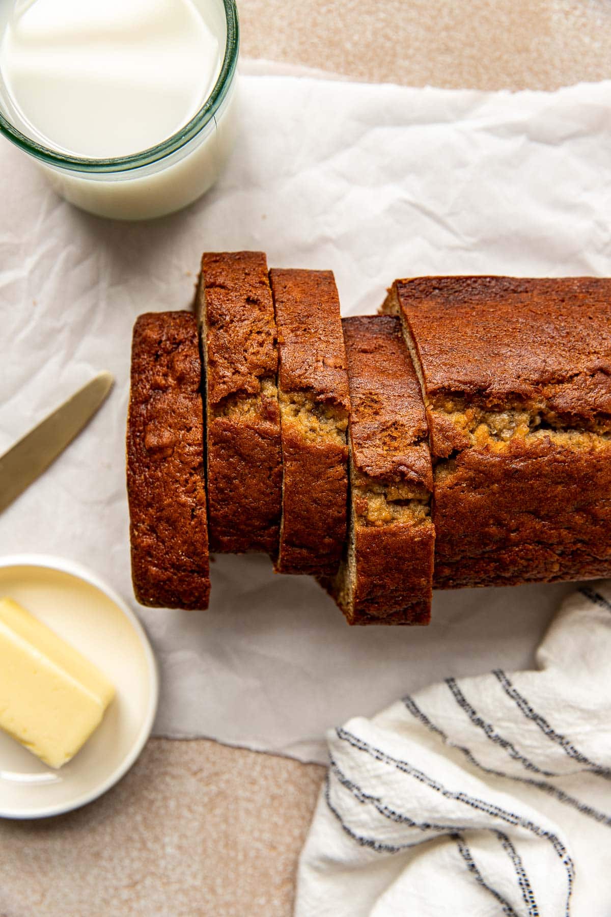sliced banana bread on white parchment paper. 