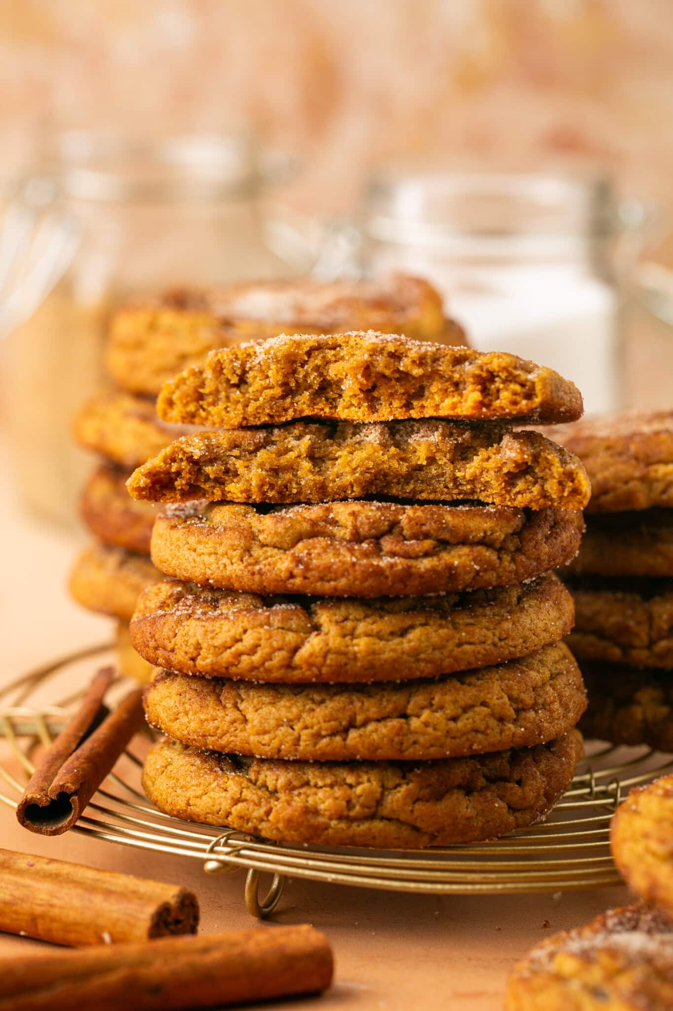 a stack of cookies on a wire cooling rack. 
