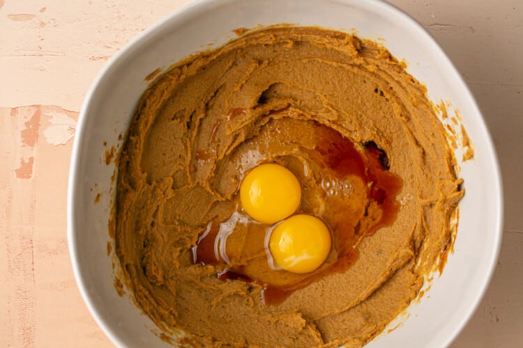 eggs added to wet ingredients in a bowl