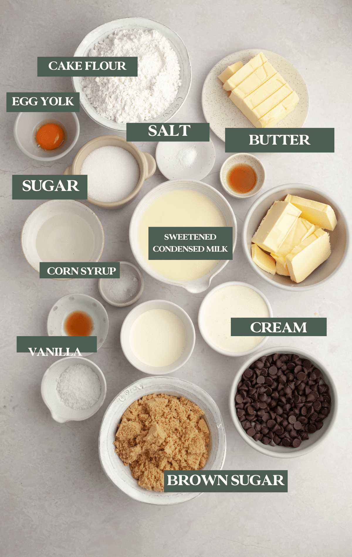 ingredients in glass bowls needed to make millionaire bars. 